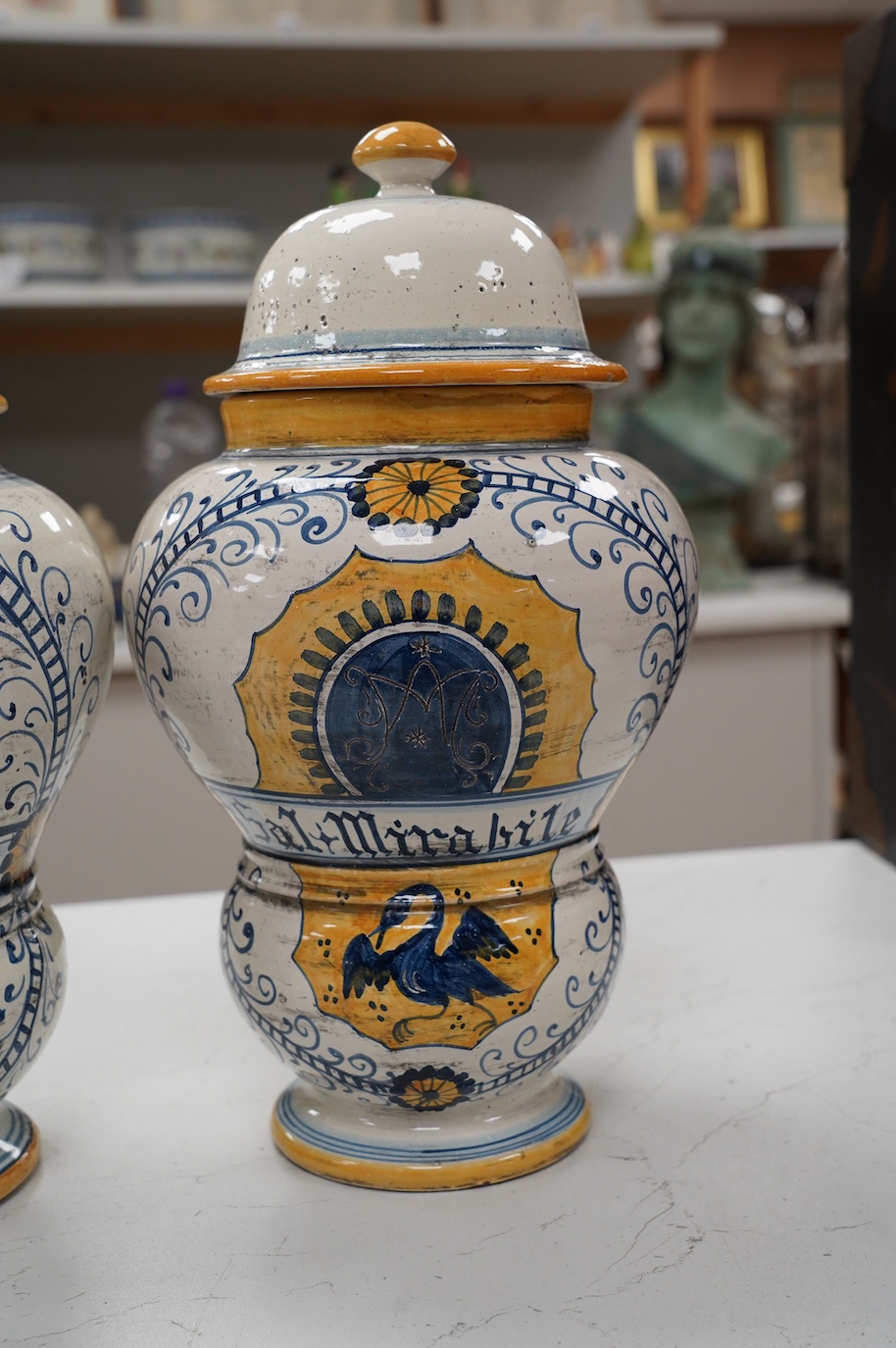 A pair of 17th century style maiolica drug jars and covers, 34cm. Condition - good